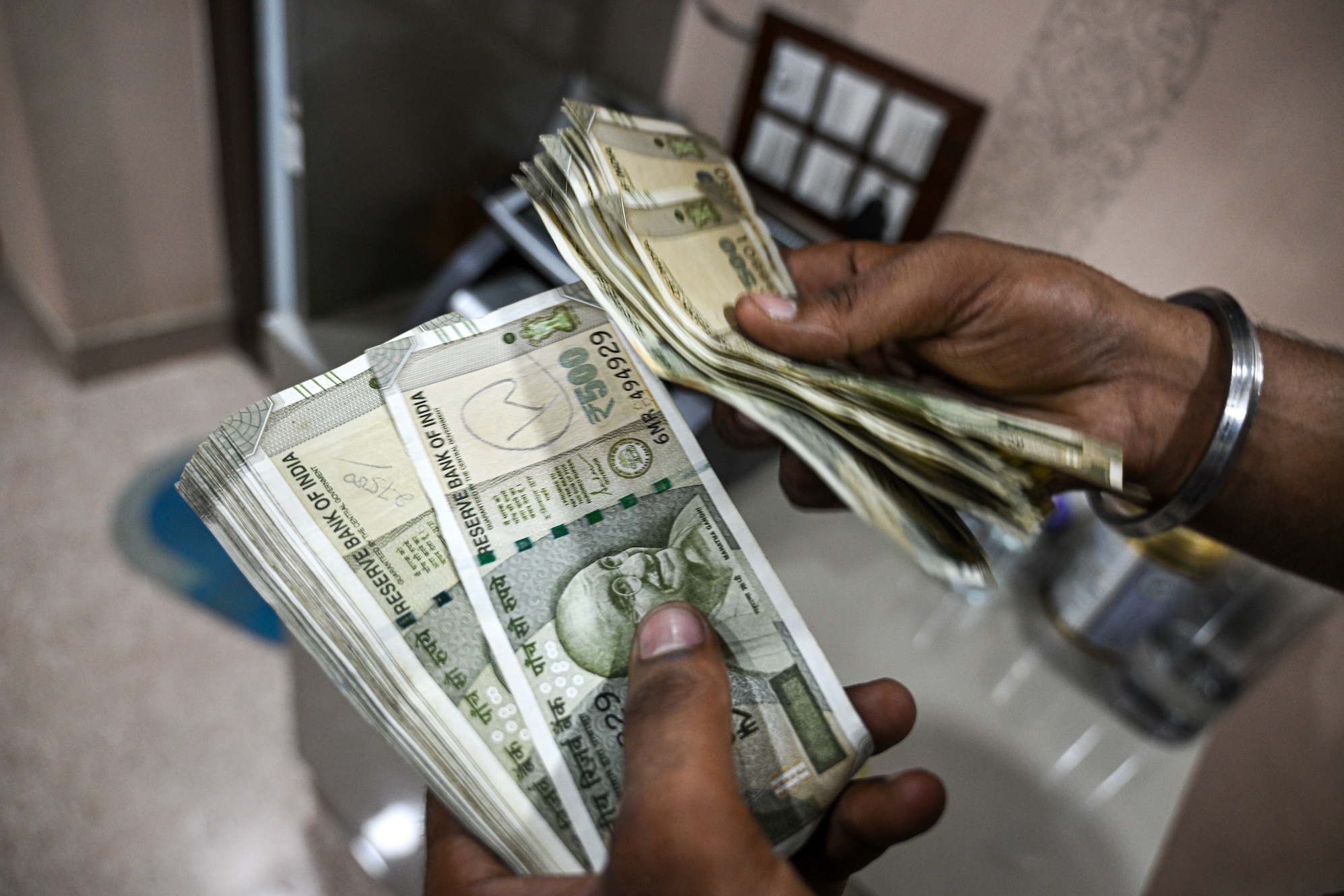 india-cash-money-transfers-2232346772.jpg